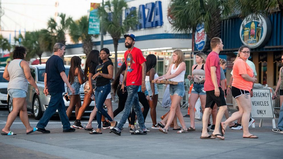 PHOTO: In this May 23, 2020, file photo, people cross N. Ocean Blvd. in Myrtle Beach, South Carolina.