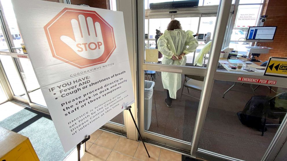 PHOTO: A nurse dons her protective gown as she prepares to diagnose a patient who may have coronavirus disease, at Rehoboth McKinley Christian Hospital on March 13, 2020 in Gallup, N. M. 