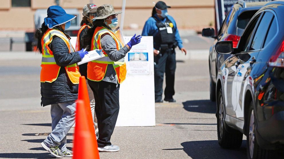 PHOTO: In this file photo, staff at the Tuba City Regional Health Care Center screen people entering their campus  on April 14, 2020. The hospital on Navajo Reservation in Arizona has seen a spike in COVID-19 cases.