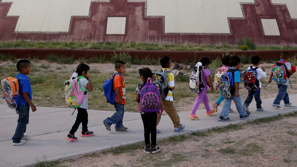 PHOTO: Students walk between buildings at the Little Singer Community School in Birdsprings, Ariz. on the Navajo Nation, Sept. 25, 2014.