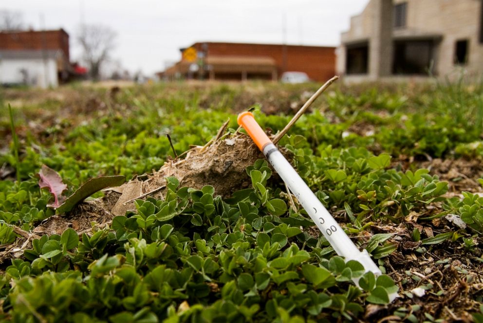 PHOTO: A syringe is seen along West Main Street in downtown Austin, Ind., in Scott County on March 24, 2015.