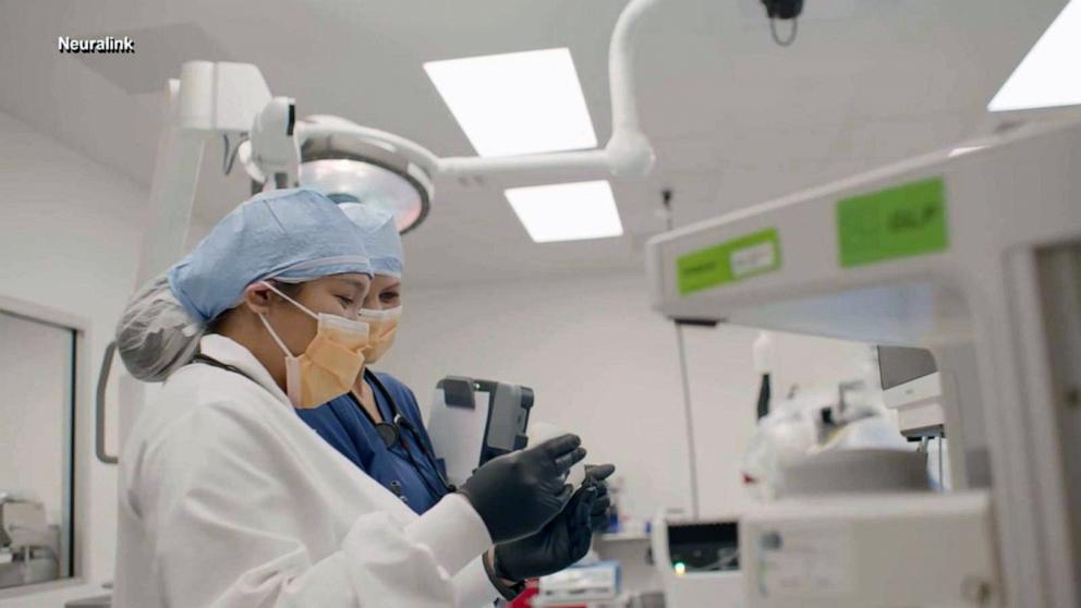 PHOTO: A Neuralink scientist is pictured testing a device.