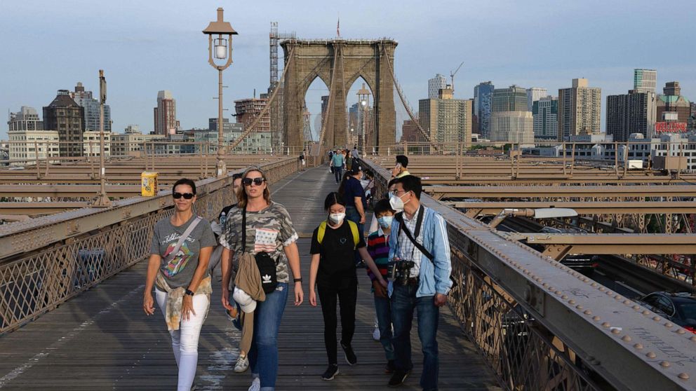 PHOTO: People walk over the Brooklyn Bridge, June 1, 2020, in New York.