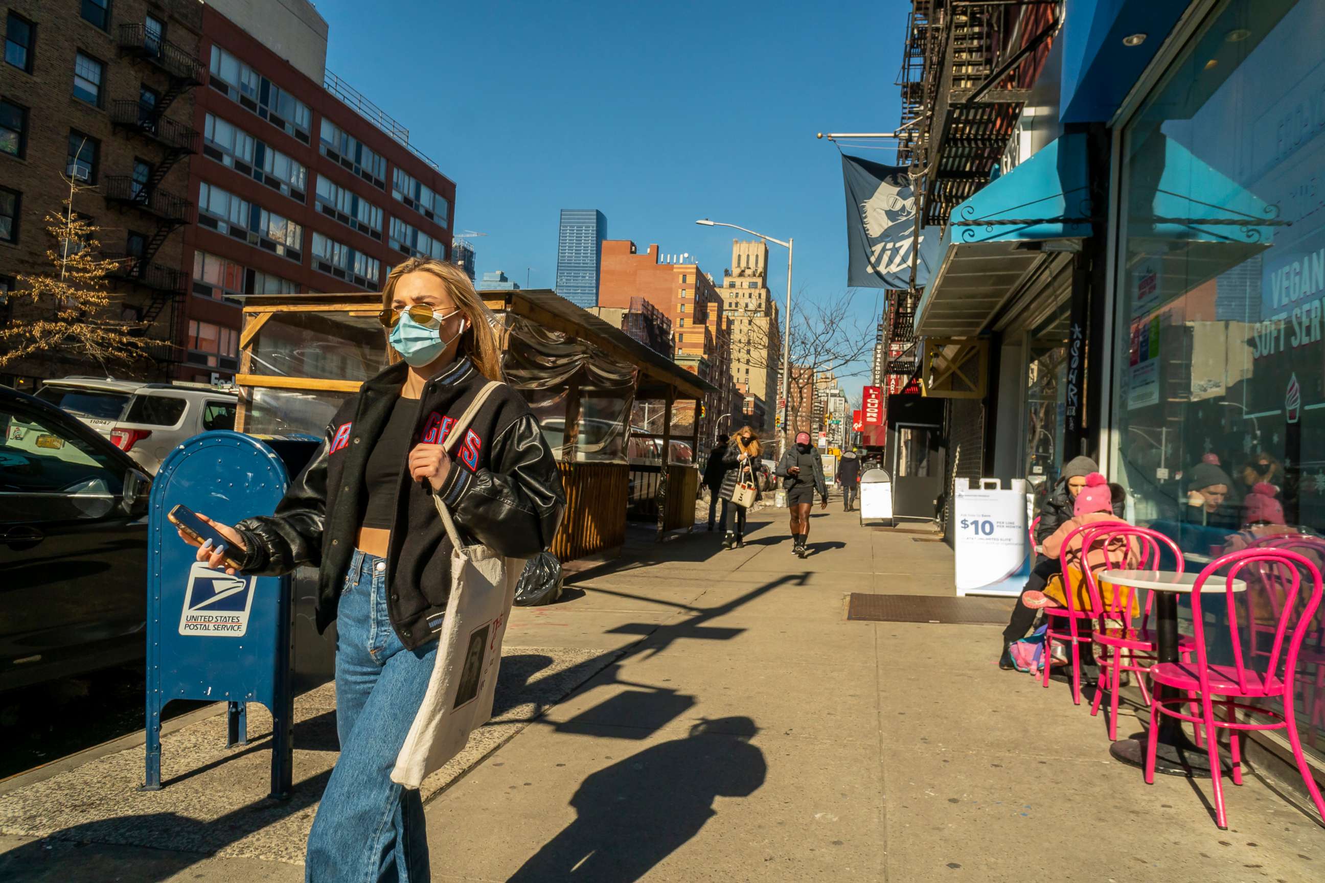 PHOTO: In this Feb. 24, 2021, file photo, masked pedestrians walk in the Chelsea neighborhood of New York.