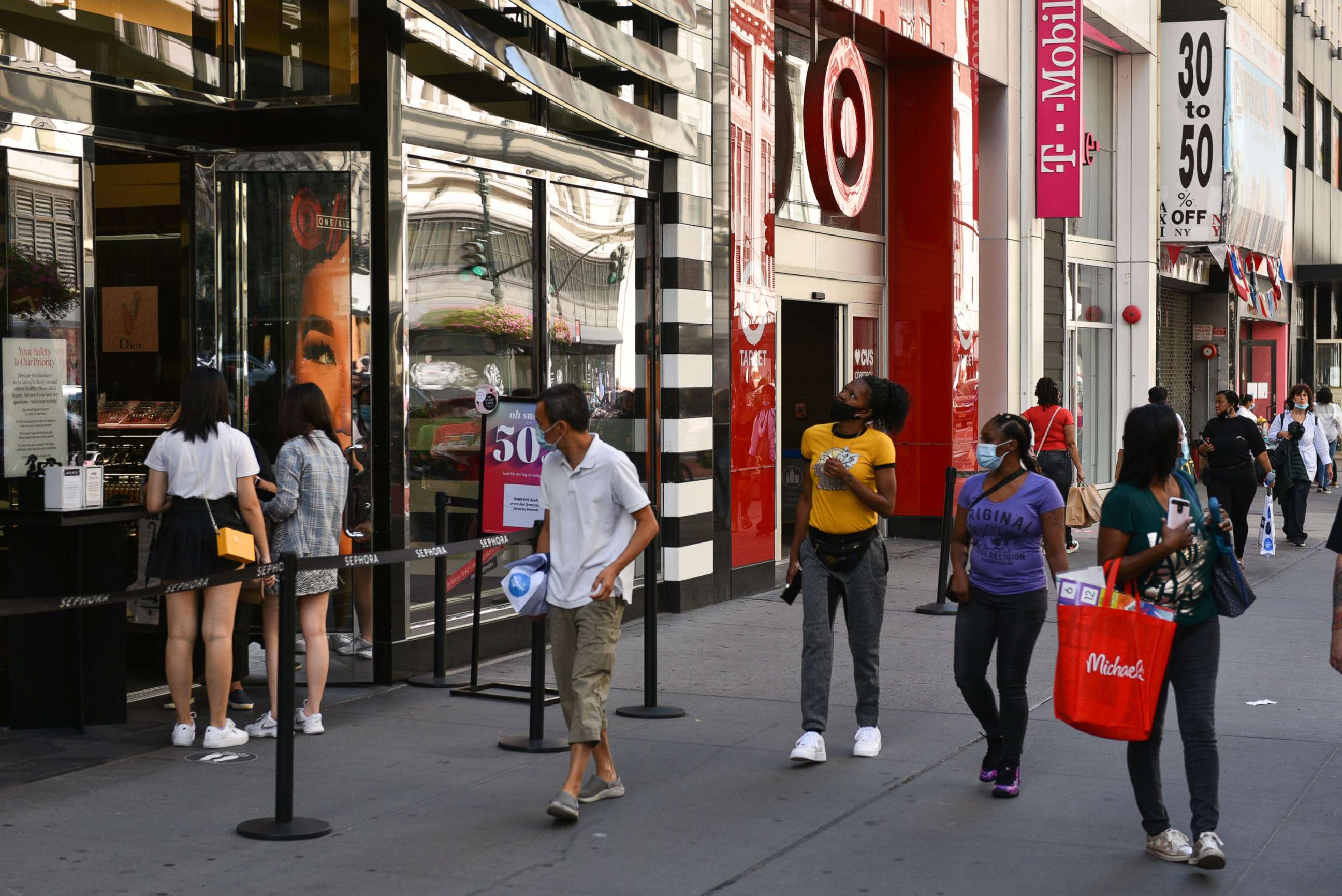 PHOTO: In this Sept. 1, 2020, file photo, people wear protective face masks while shopping along 34th Street in New York.
