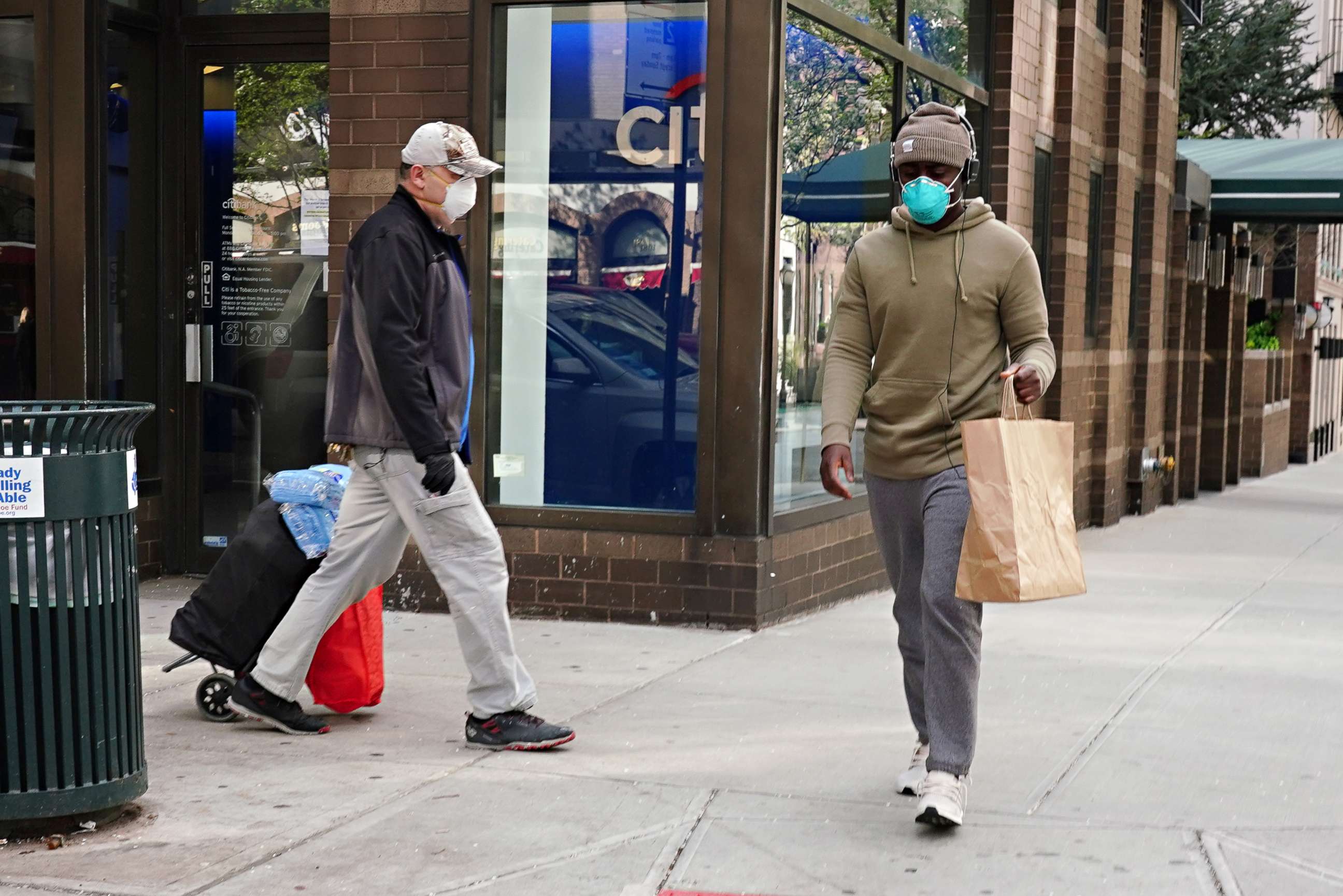 PHOTO: Men walking wearing protective masks during the coronavirus pandemic on April 08, 2020, in New York.