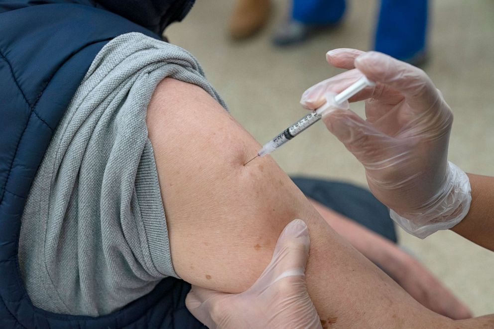 PHOTO: NA nurse administers the covid vaccine into the arm of a patient at a community-based pop-up vaccination site in Chinatown at Confucius Plaza Community Center, Feb. 13, 2021, in New York City.