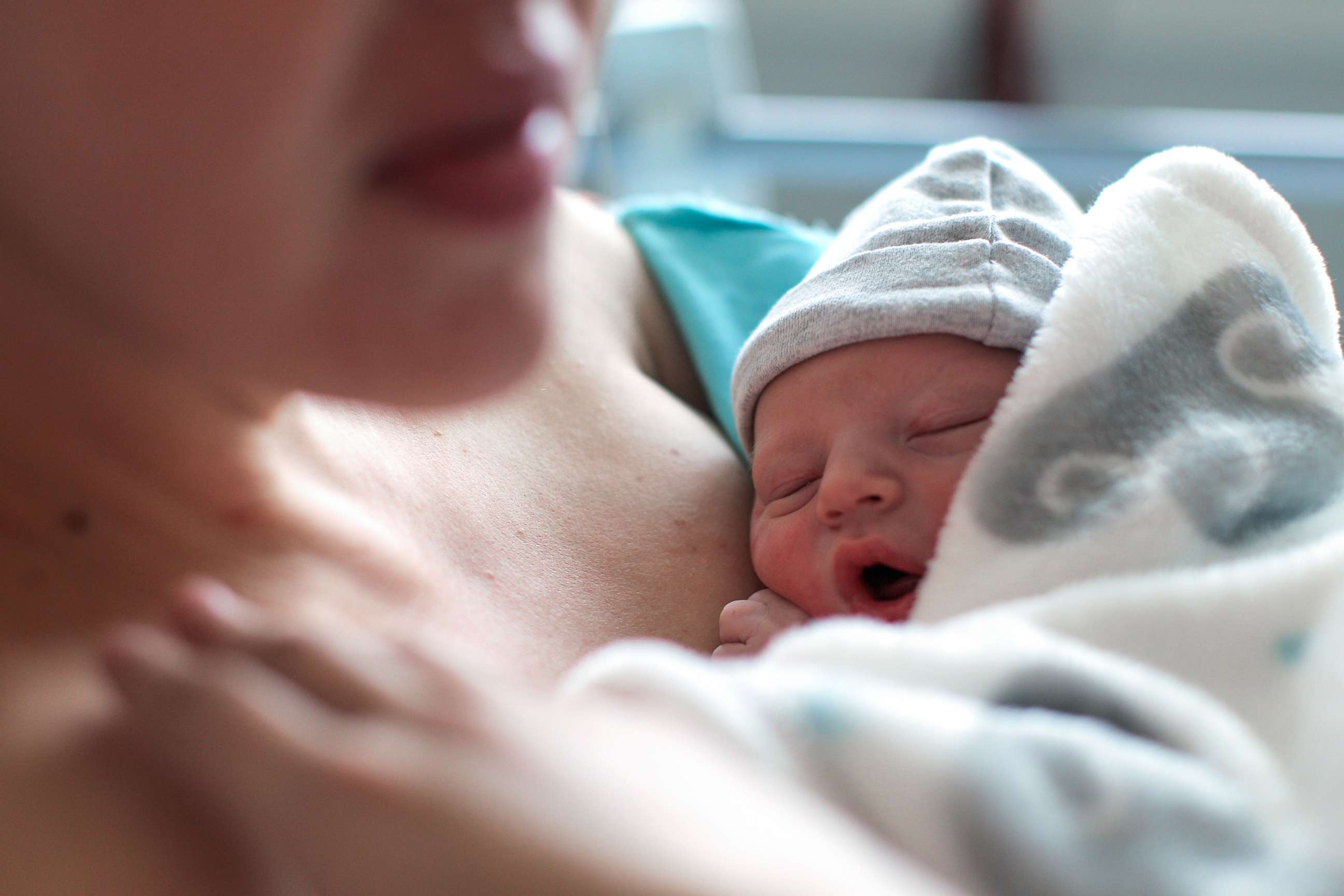 PHOTO: A newborn baby boy breastfeeding for the first time at a hospital.
