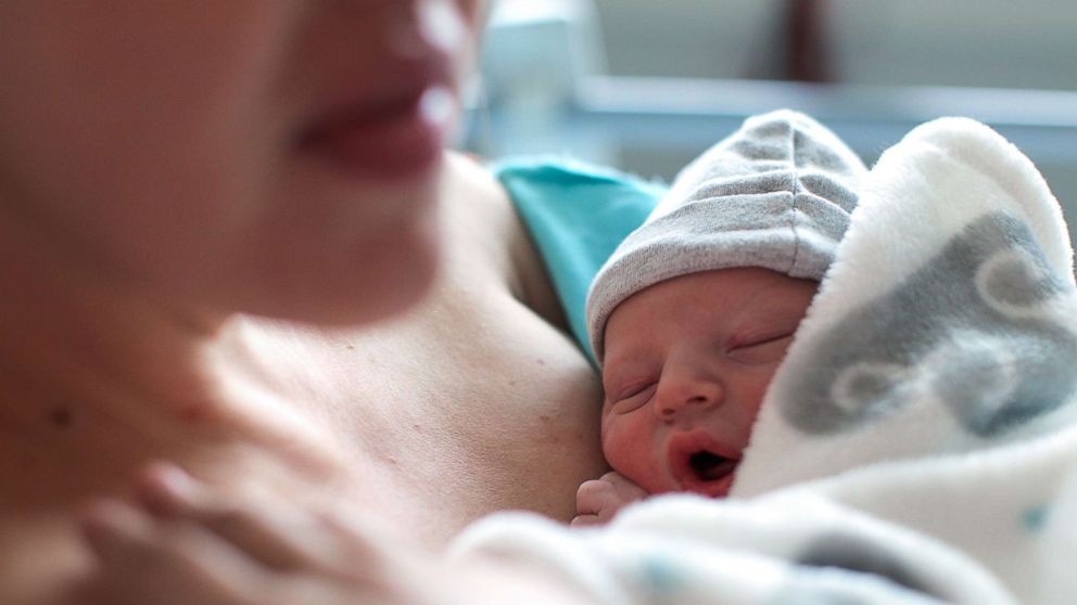 PHOTO: A newborn baby boy breastfeeding for the first time at a hospital.