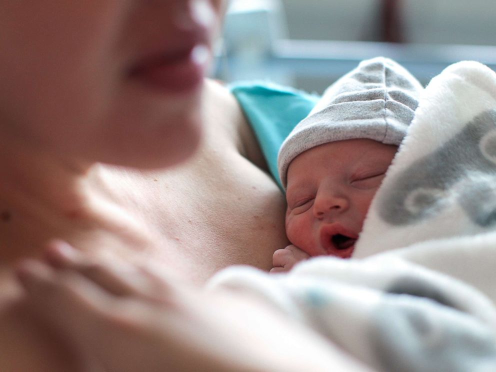 PHOTO: A newborn baby boy breastfeeding for the first time at a hospital.