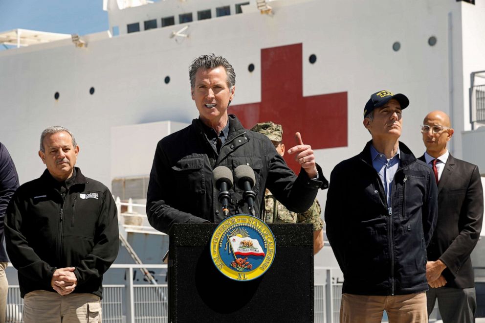 PHOTO: California Governor Gavin Newsom speaks in front of the hospital ship USNS Mercy that arrived into the Port of Los Angeles on Friday, March 27, 2020.