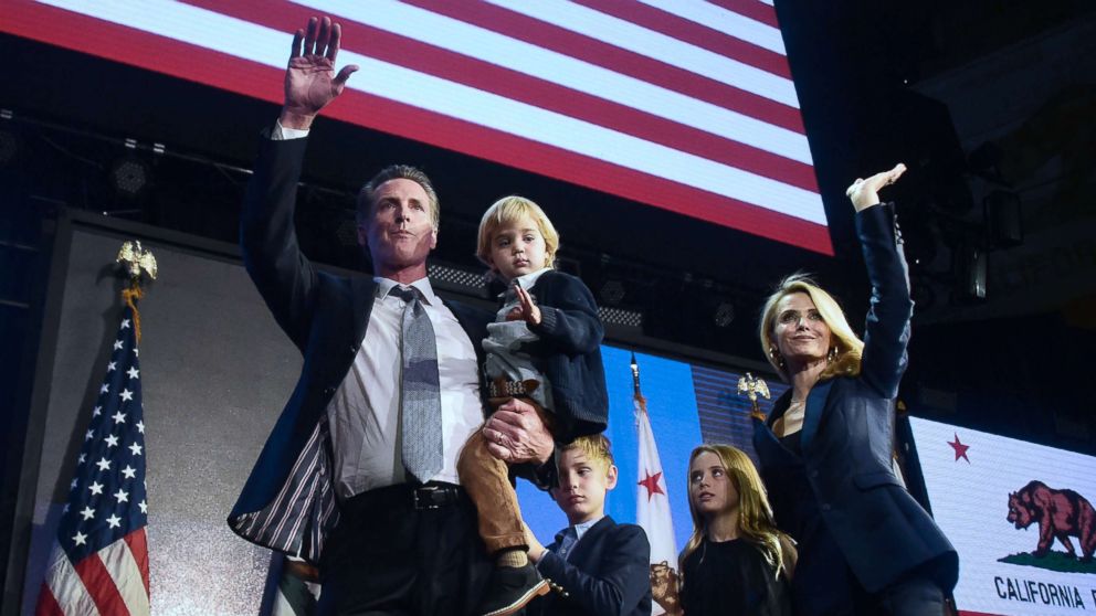 PHOTO: California's Democratic gubernatorial candidate Gavin Newsom and his family wave to supporters from the stage at his election night watch party in Los Angeles, Nov, 6, 2018.