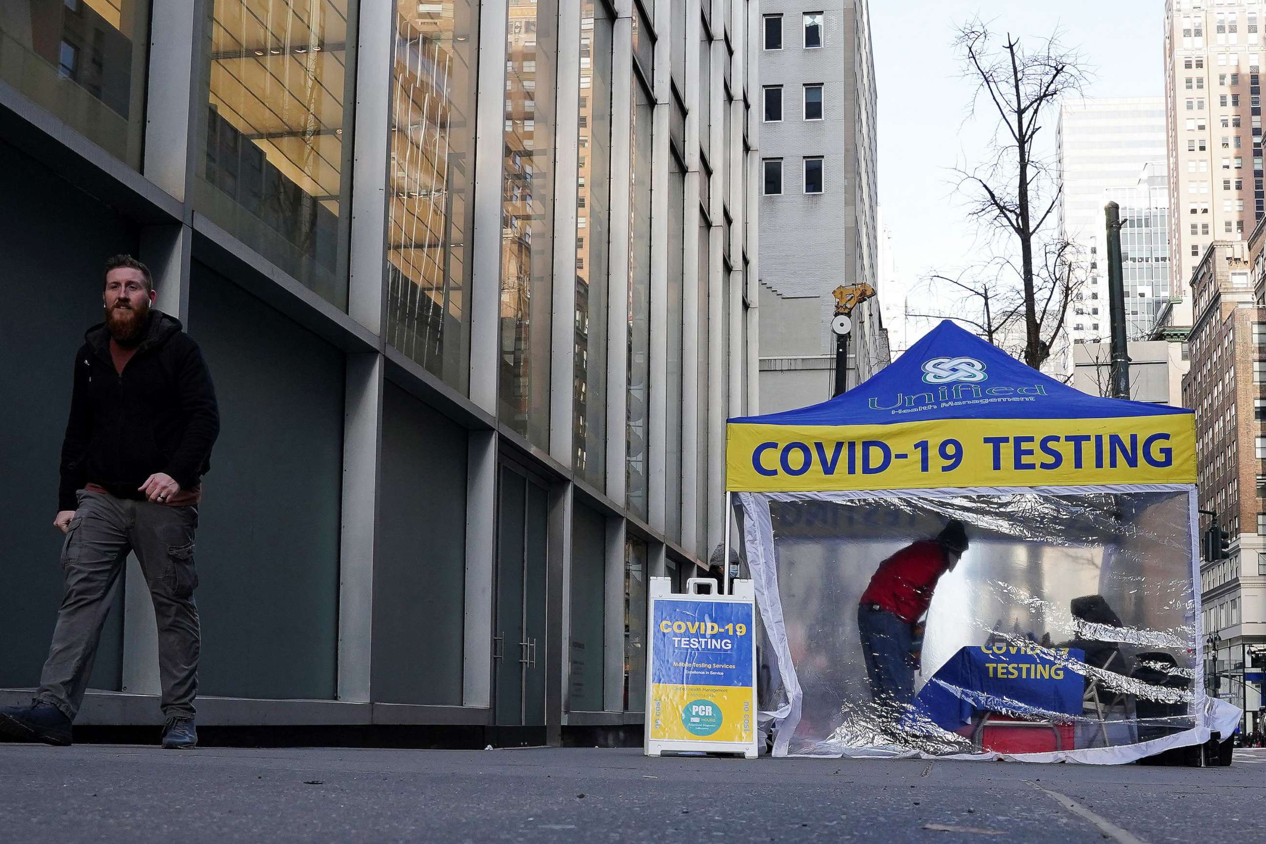 PHOTO: A person walks past a COVID-19 testing tent during the coronavirus pandemic in the Manhattan borough of New York City, Jan. 14, 2022.