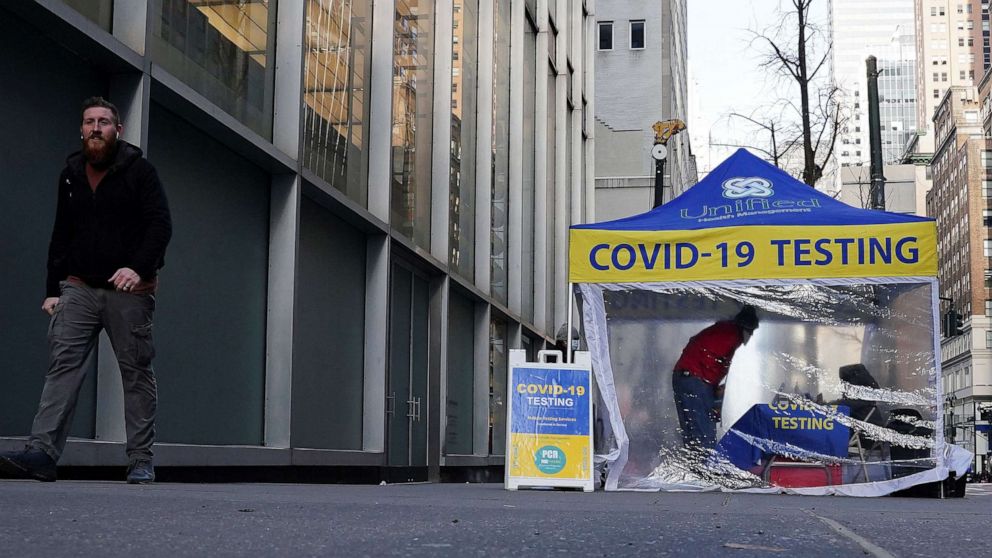 PHOTO: A person walks past a COVID-19 testing tent during the coronavirus pandemic in the Manhattan borough of New York City, Jan. 14, 2022.