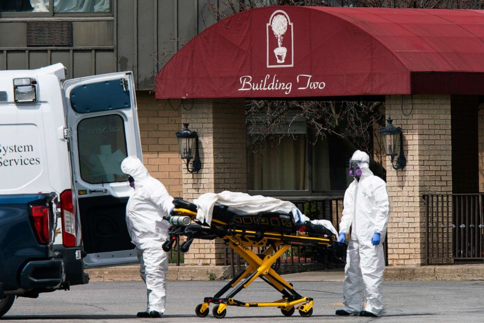PHOTO: Medical workers load a body into an ambulance at Andover Subacute and Rehabilitation Center on April 16, 2020 in Andover, N.J.