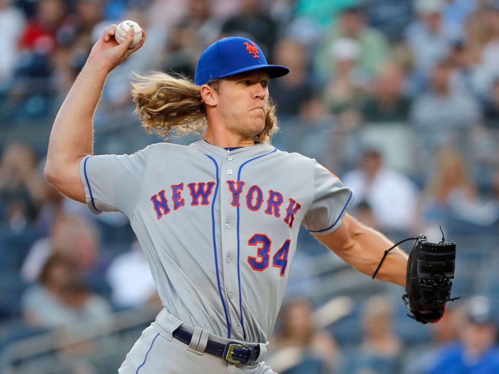  PHOTO: New York Mets start pitcher Noah Syndergaard delivers against the New York Yankees in the first round of a baseball game on July 20, 2018 in New York. 
