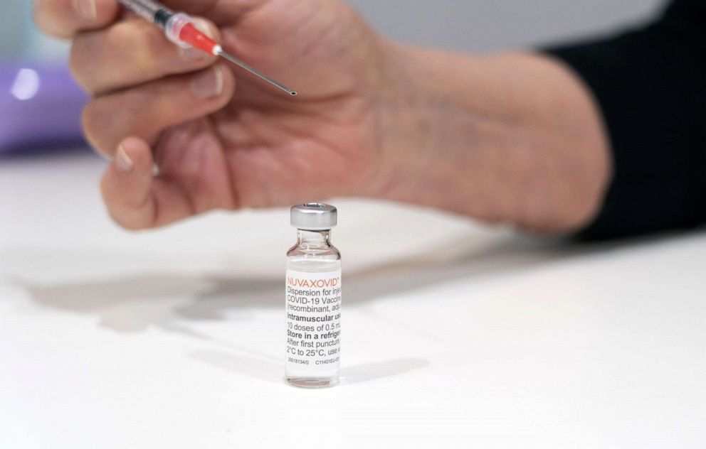 PHOTO: A healthcare worker prepares a dose of the COVID-19 vaccine from Novavax in Utrecht, Netherlands, March 15, 2022. 