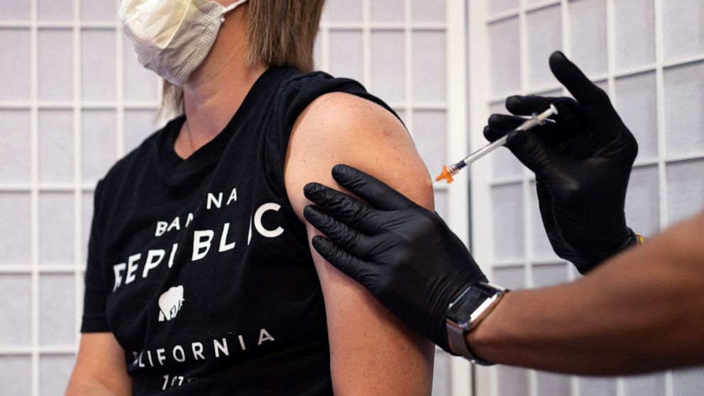 PHOTO: A healthcare worker administers a dose of the Novavax COVID-19 vaccine at a pharmacy in Schwenksville, Pa., Aug. 1, 2022.