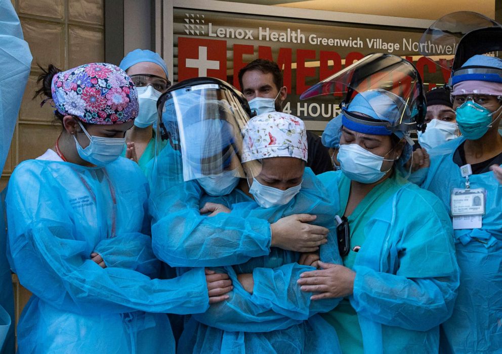 PHOTO: In this April 28, 2020, file photo, a nurse breaks down during the 7pm show of appreciation by Greenwich Village residents at Lenox Hill Medical Center in New York.