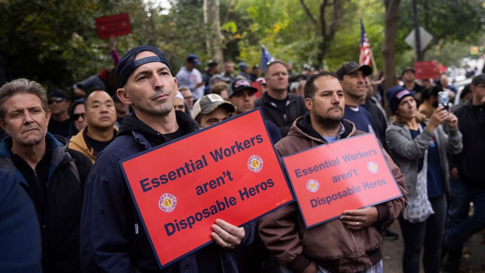 PHOTO: New York City municipal workers protest outside the Gracie Mansion Conservancy against the coming COVID-19 vaccine mandate for city workers, Oct. 28, 2021, in New York.