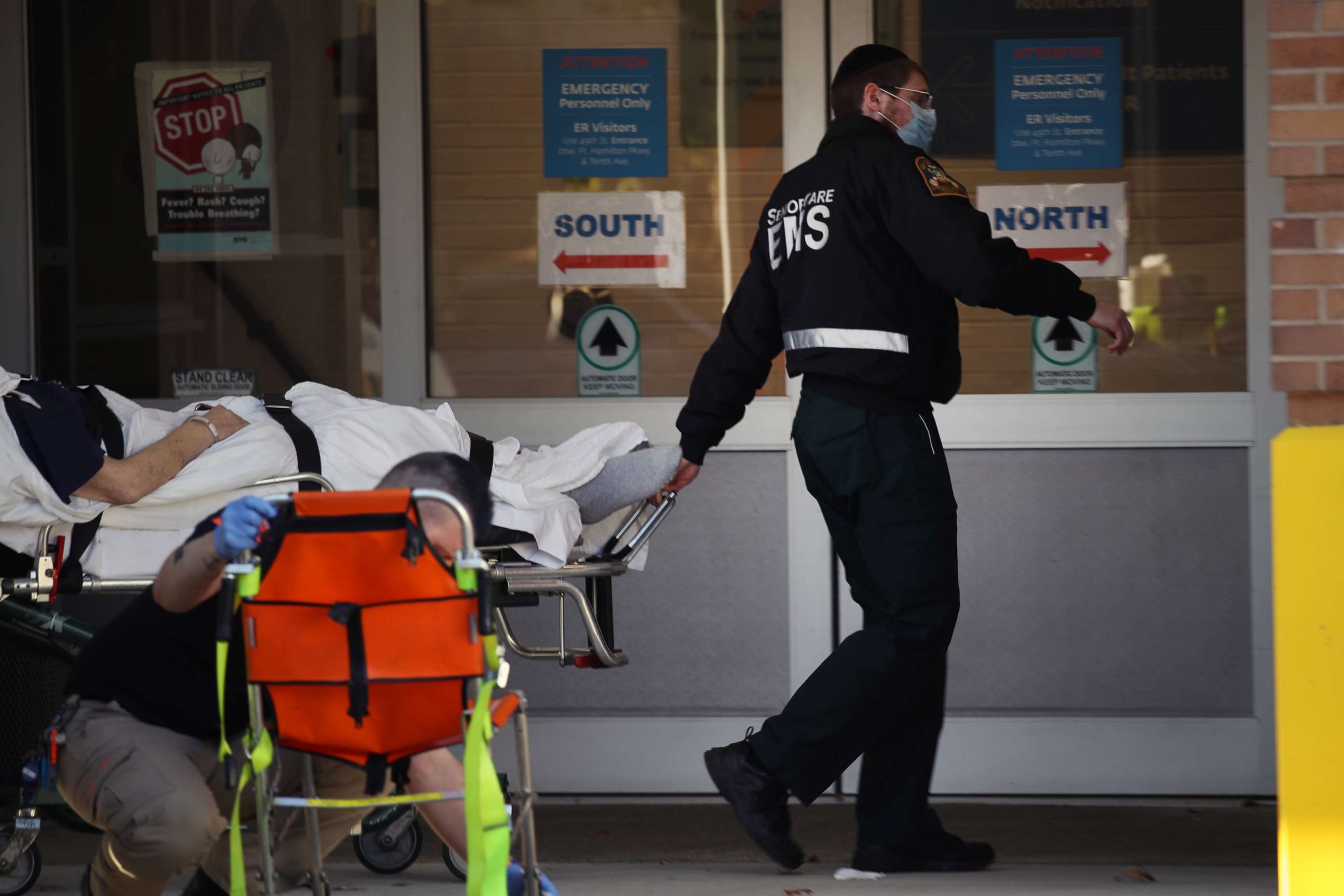 PHOTO: Medical workers deliver a patient to the Maimonides Medical Center on November 23, 2020 in the Brooklyn borough of New York City. 