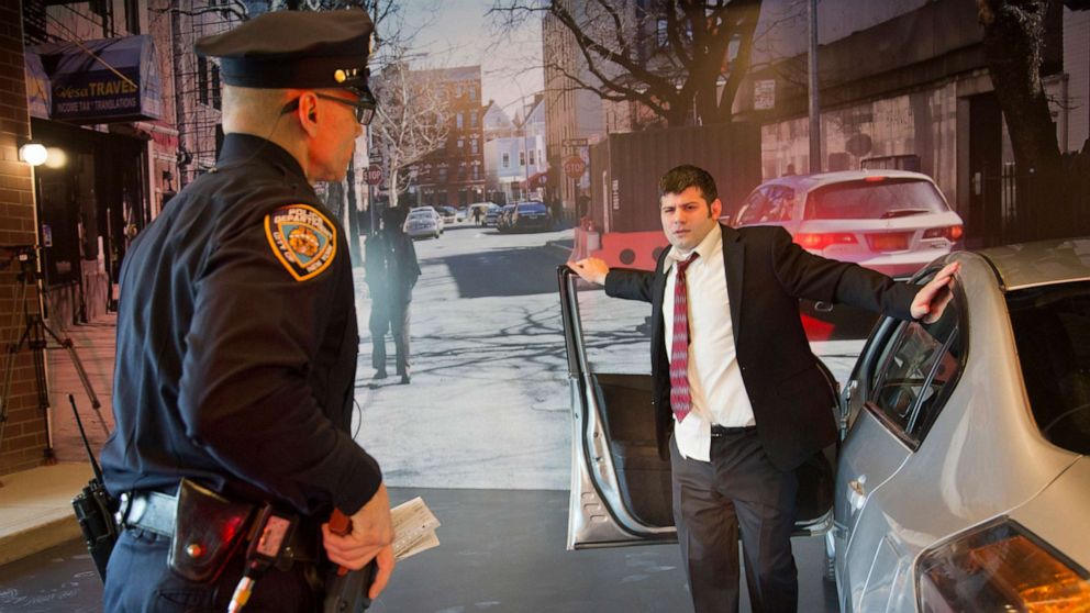 PHOTO: In this Tuesday, March 31, 2015 photo, an NYPD detective and a police officer stage a car stop of a suspected drunk driver during a training demonstration at the new NYPD police academy facility, in New York.