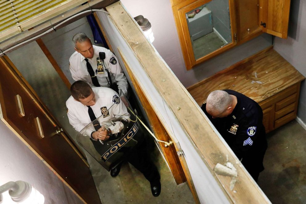 PHOTO: NYPD Chief Robert Lukach, background center, and Capt. Ronald Zedalis, left, negotiate with Sgt. Kenneth O'Brien portraying a barricaded person during a tactical demonstration at Emergency Service Unit headquarters in New York, March 28, 2019.