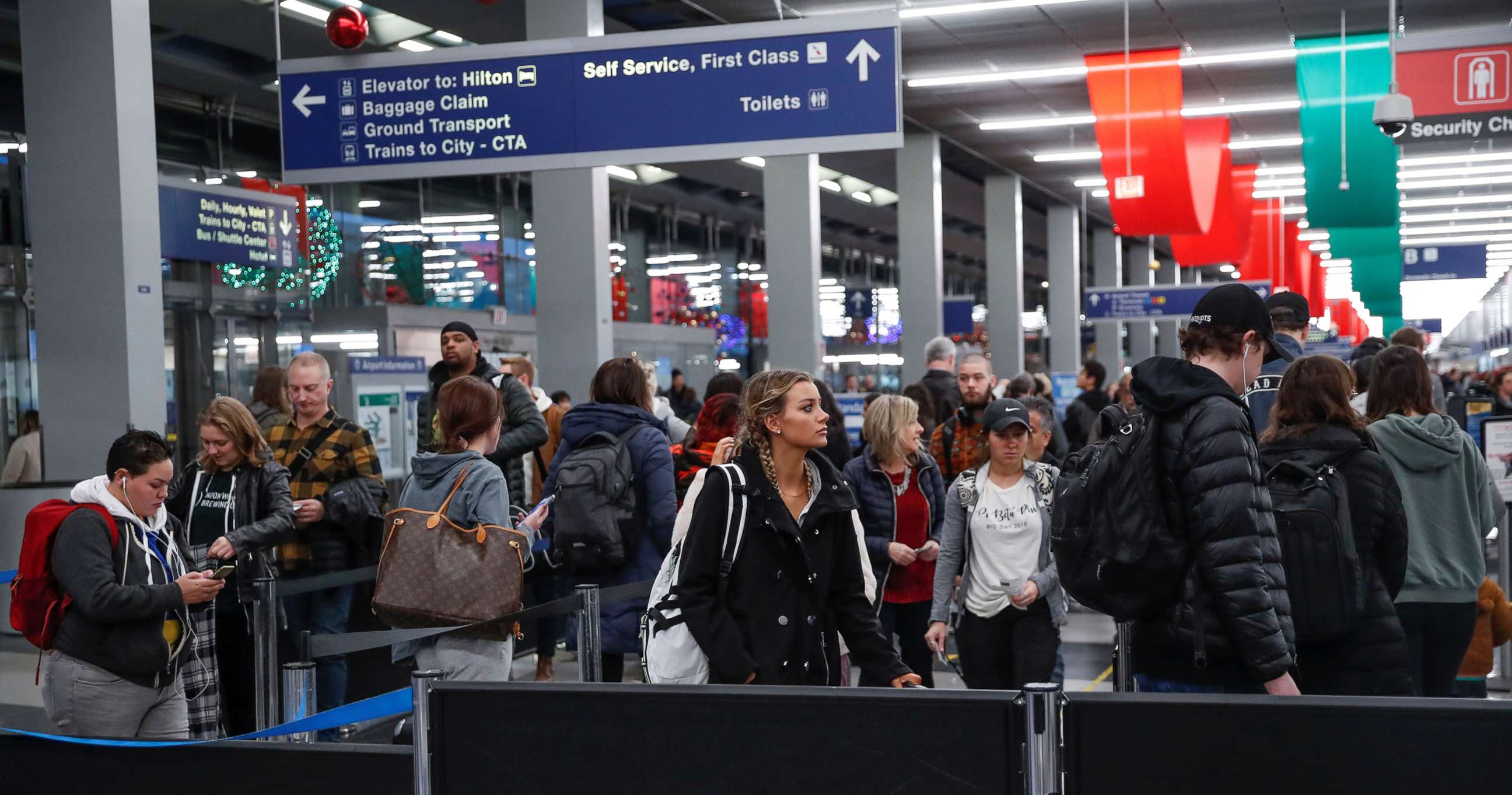 PHOTO: Travelers queue during the Thanksgiving holiday travel rush at O'Hare Airport in Chicago, Nov. 27, 2019.