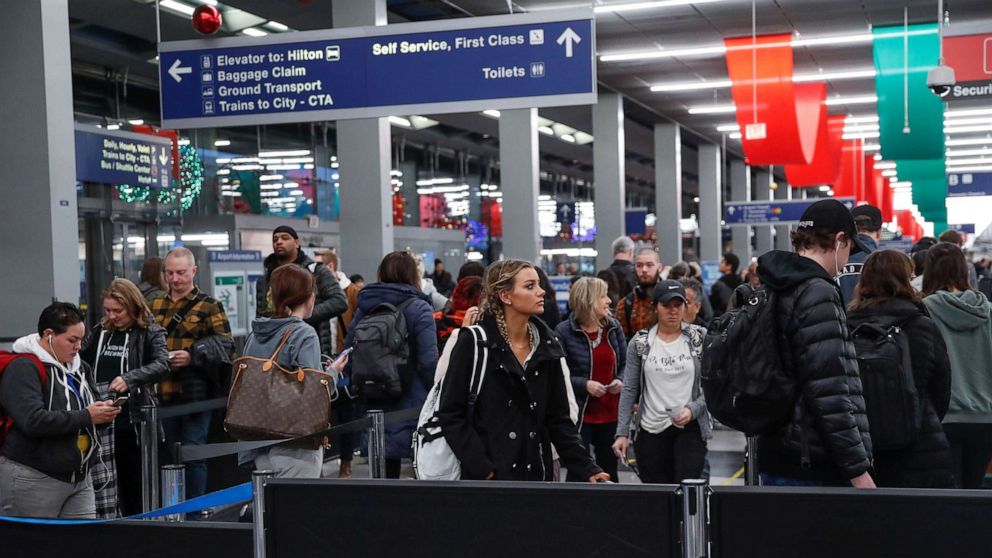 PHOTO: Travelers queue during the Thanksgiving holiday travel rush at O'Hare Airport in Chicago, Nov. 27, 2019.
