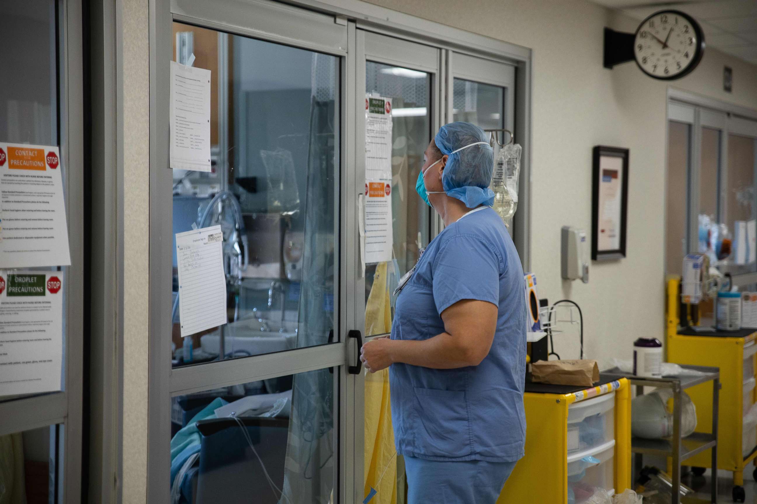 PHOTO: A healthcare professional prepares to enter a COVID-19 patient's room in the ICU at Van Wert County Hospital in Van Wert, Ohio on Nov. 20, 2020.
