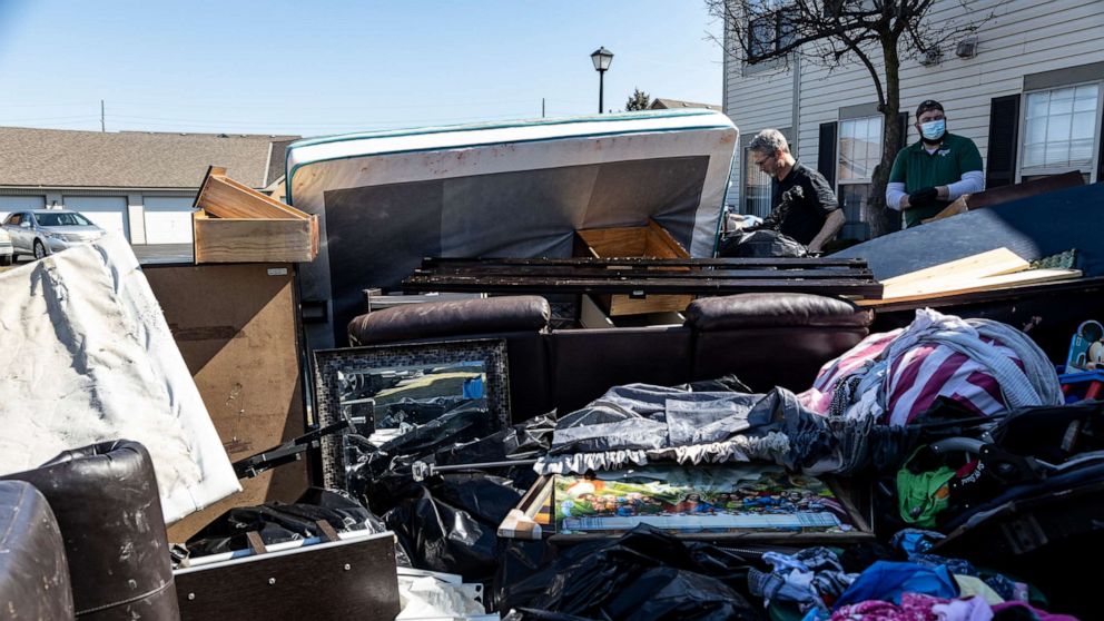 PHOTO: Workers remove belongings from a residence during an eviction in the unincorporated community of Galloway on March 3, 2021, outside Columbus, Ohio.