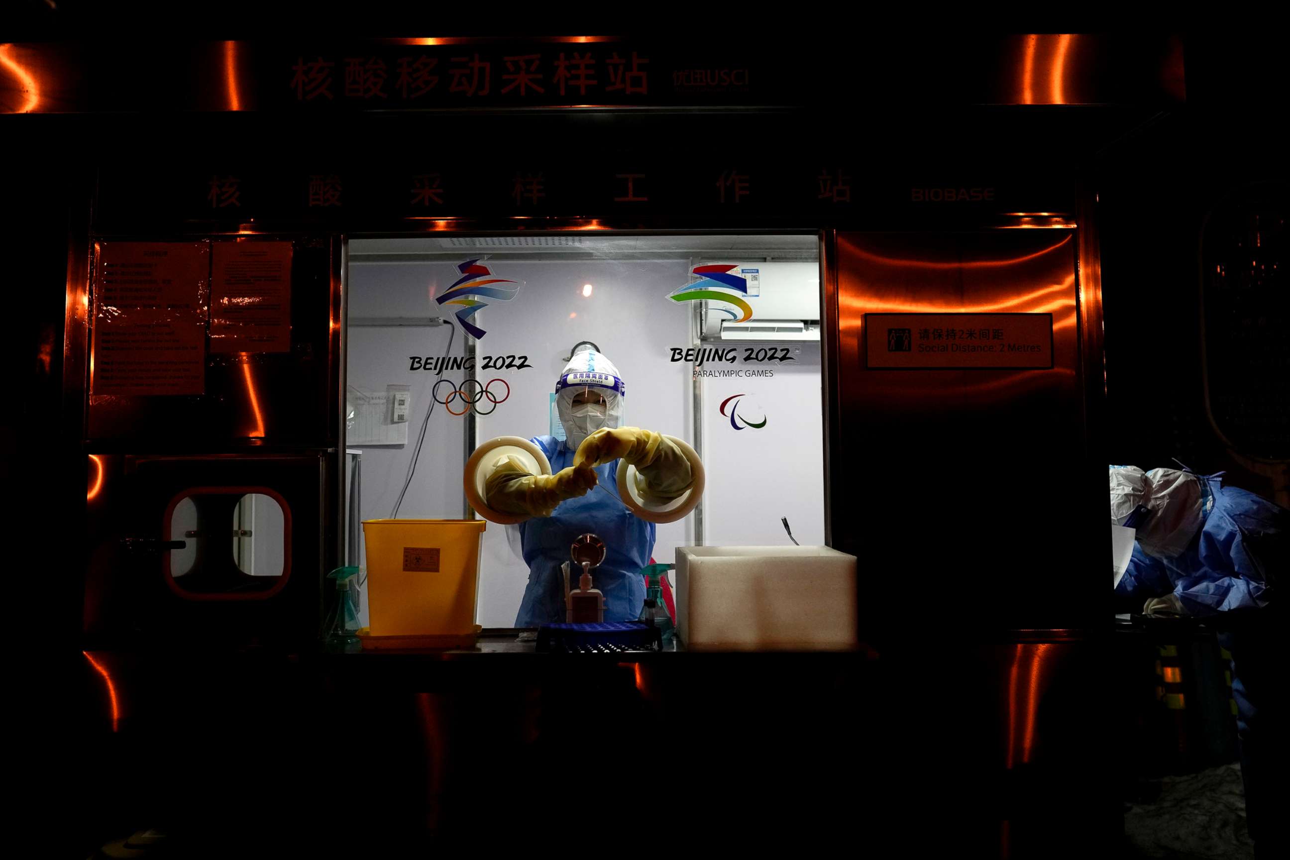 PHOTO: A worker prepares to administer a COVID-19 test at the 2022 Winter Olympics, Feb. 2, 2022, in Beijing.