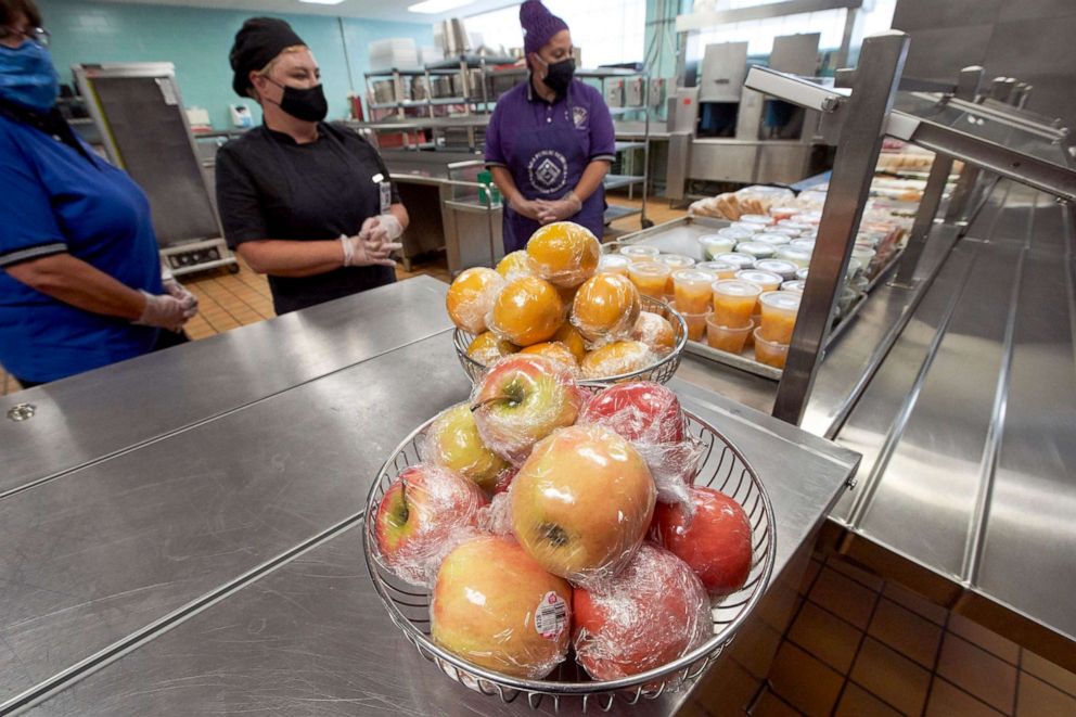PHOTO: Individually wrapped apples and oranges and fruit in plastic cups are seen at the cafeteria during a media tour of the Norris Middle School in Omaha, Neb., July 29, 2020, in preparation for the return of students to school in the time of Covid-19.