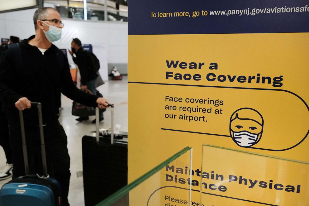 PHOTO: Travelers arrive from international flights at Newark Liberty International Airport, Nov. 30, 2021, in Newark, N.J. 