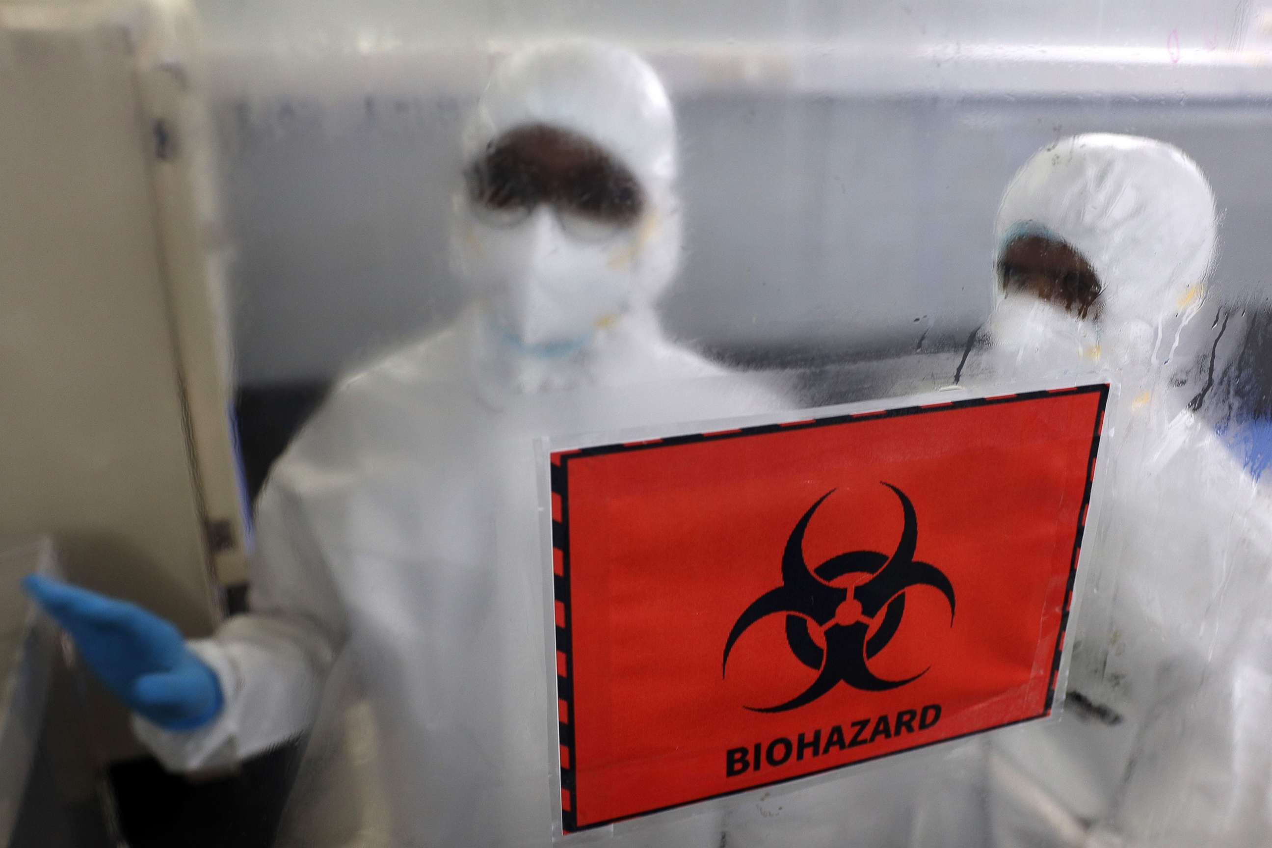 PHOTO: Health workers wearing personal protective equipment are seen inside the molecular laboratory facility set up by the Tamil Nadu Health Department to test the Monkeypox virus in Chennai, India, July 28, 2022.