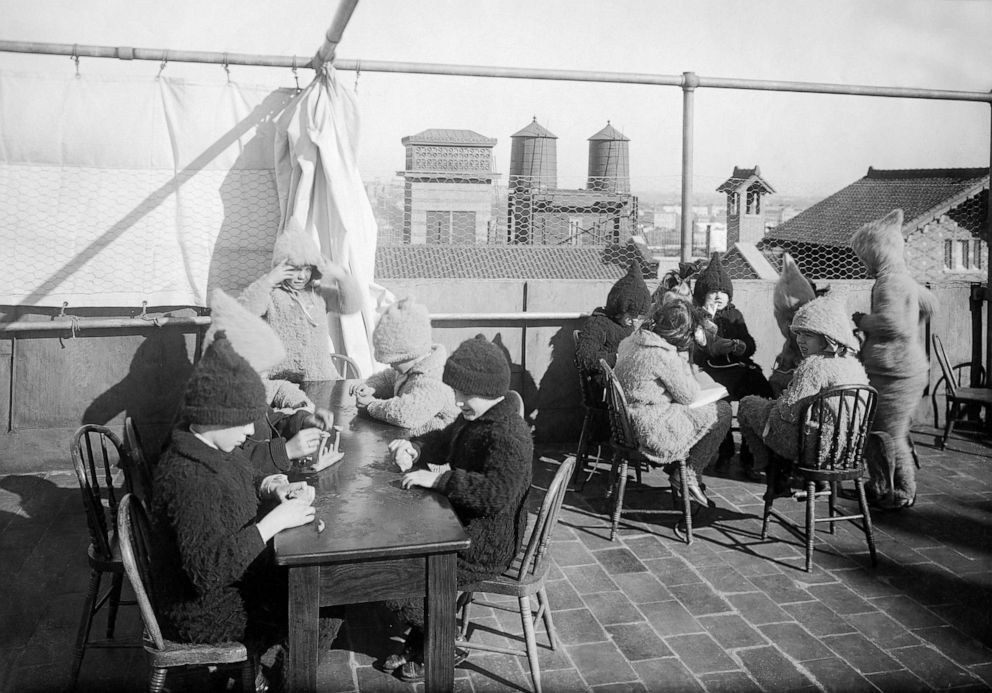PHOTO: Children do handicrafts during open-air school on a rooftop in New York City, 1912.