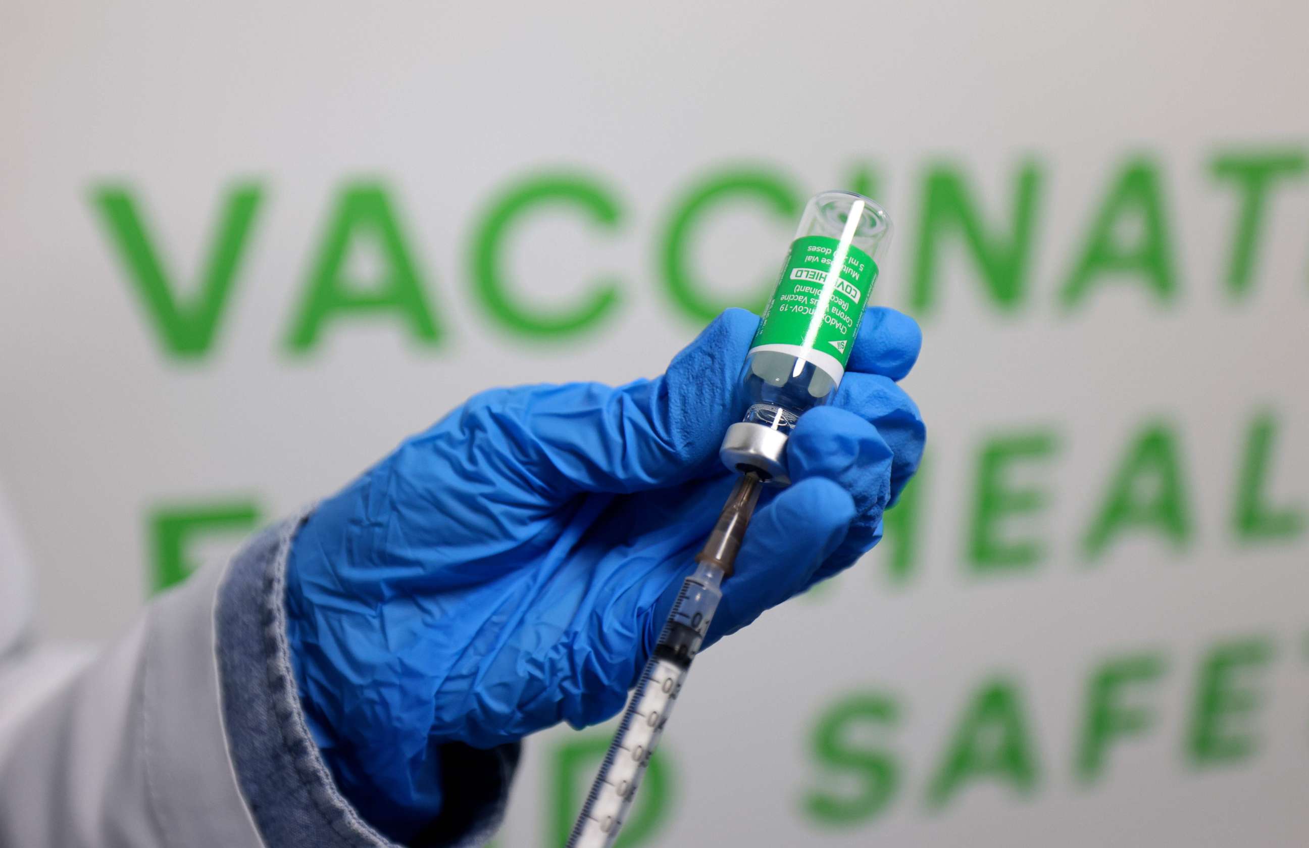 PHOTO: A health worker prepares an injection of the Oxford vaccine against the coronavirus at a vaccination centre set up at the Dubai International Financial Center in the Gulf emirate of Dubai, on February 3, 2021. 