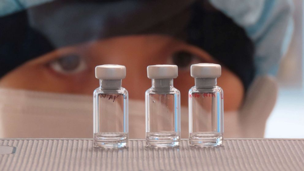 PHOTO: A scientist checks quality control of vaccine vials for correct volume at the Clinical Biomanufacturing Facility (CBF) in Oxford, Britain, April 2, 2020. 