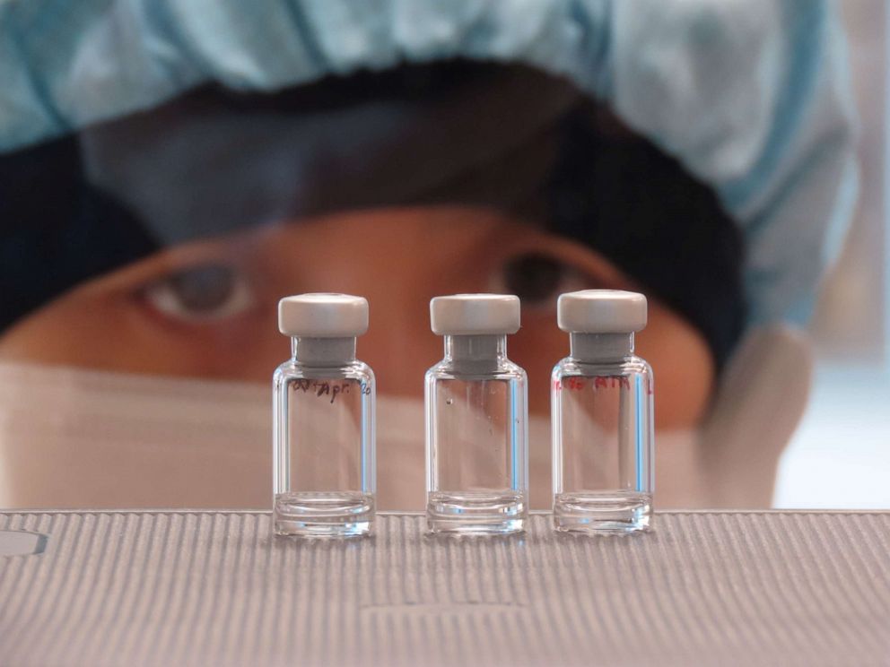 PHOTO: A scientist checks quality control of vaccine vials for correct volume at the Clinical Biomanufacturing Facility (CBF) in Oxford, Britain, April 2, 2020. 