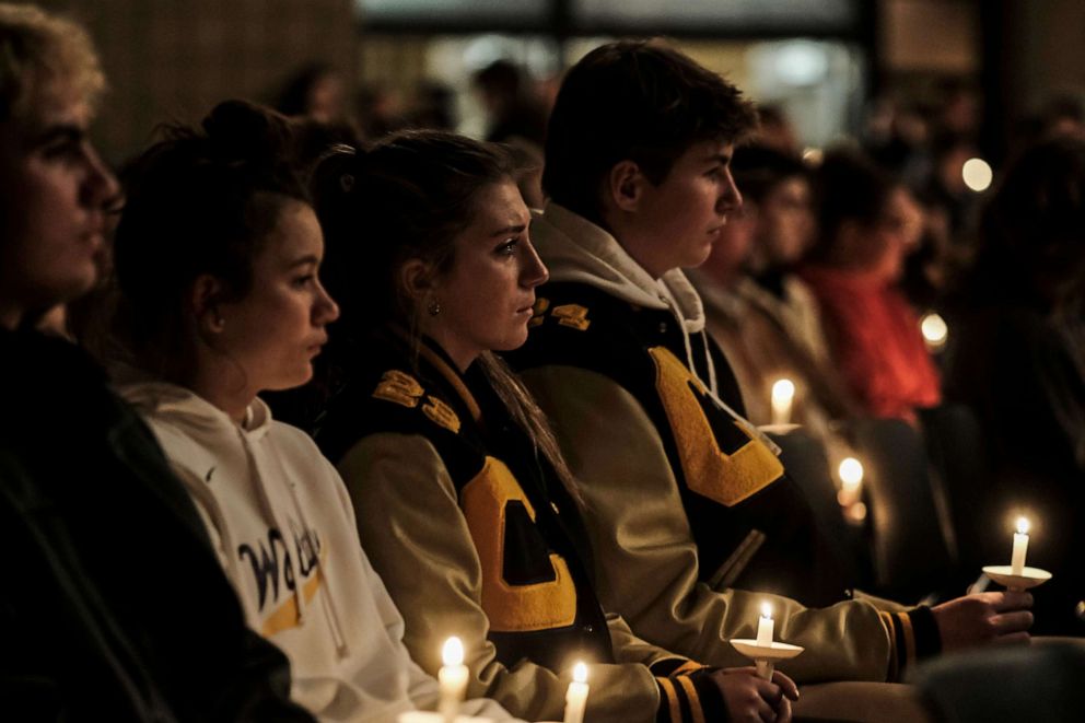 PHOTO: Students, parents, teachers, and community members gather for a vigil at the Lake Point Community Church following a shooting at Oxford High School on Nov. 30, 2021 in Oxford, Mich.