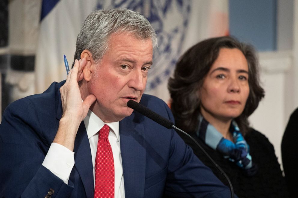 PHOTO: In this Feb. 26, 2020 file photo, Mayor Bill de Blasio, left, with Dr. Oxiris Barbot, commissioner of the New York City Department of Health and Mental Hygiene, listens to a reporter's question in New York. 