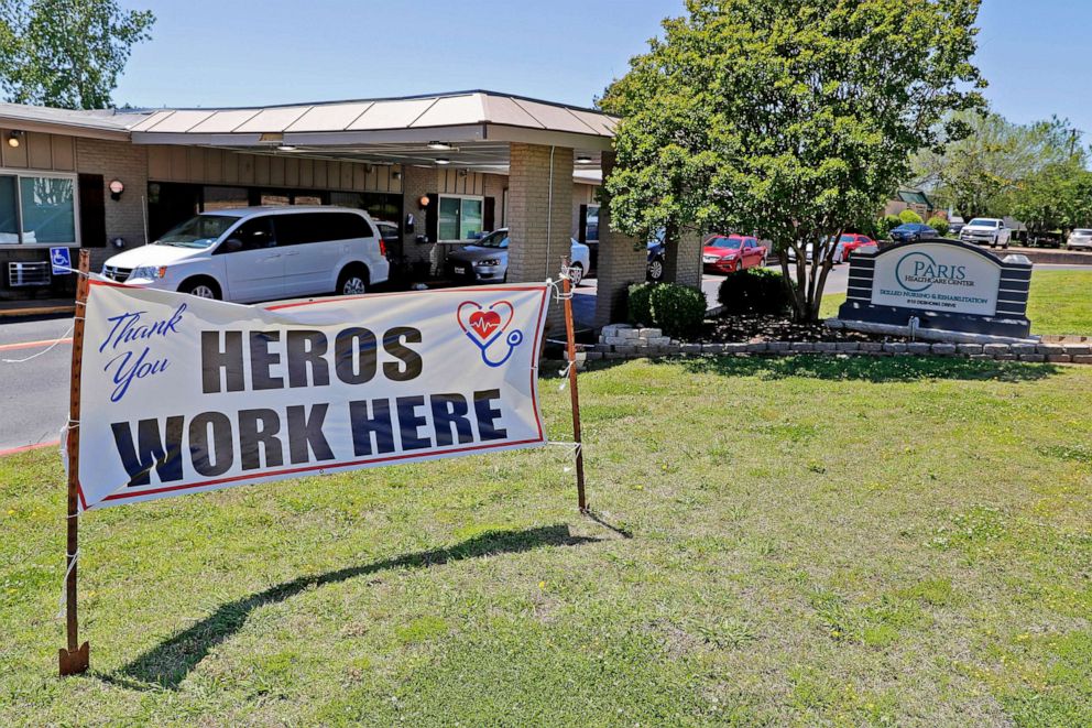 PHOTO: A sign praising the staff at Paris Healthcare Center sits in front of the business in Paris, Texas, April 29, 2020.