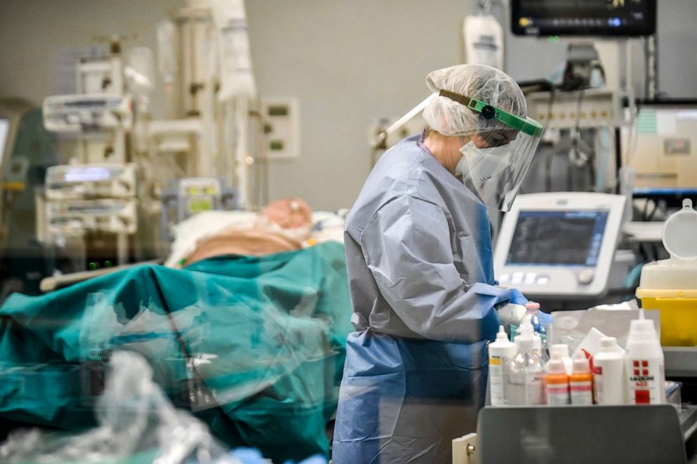 PHOTO: Doctors work on Covid-19 patients in the intensive care unit of San Matteo Hospital, in Pavia, northern Italy, March 26, 2020.