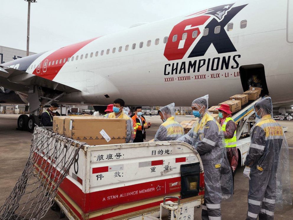 PHOTO: Workers load an inventory of N95 masks aboard the New England Patriots plane in China on April 2, 2020.