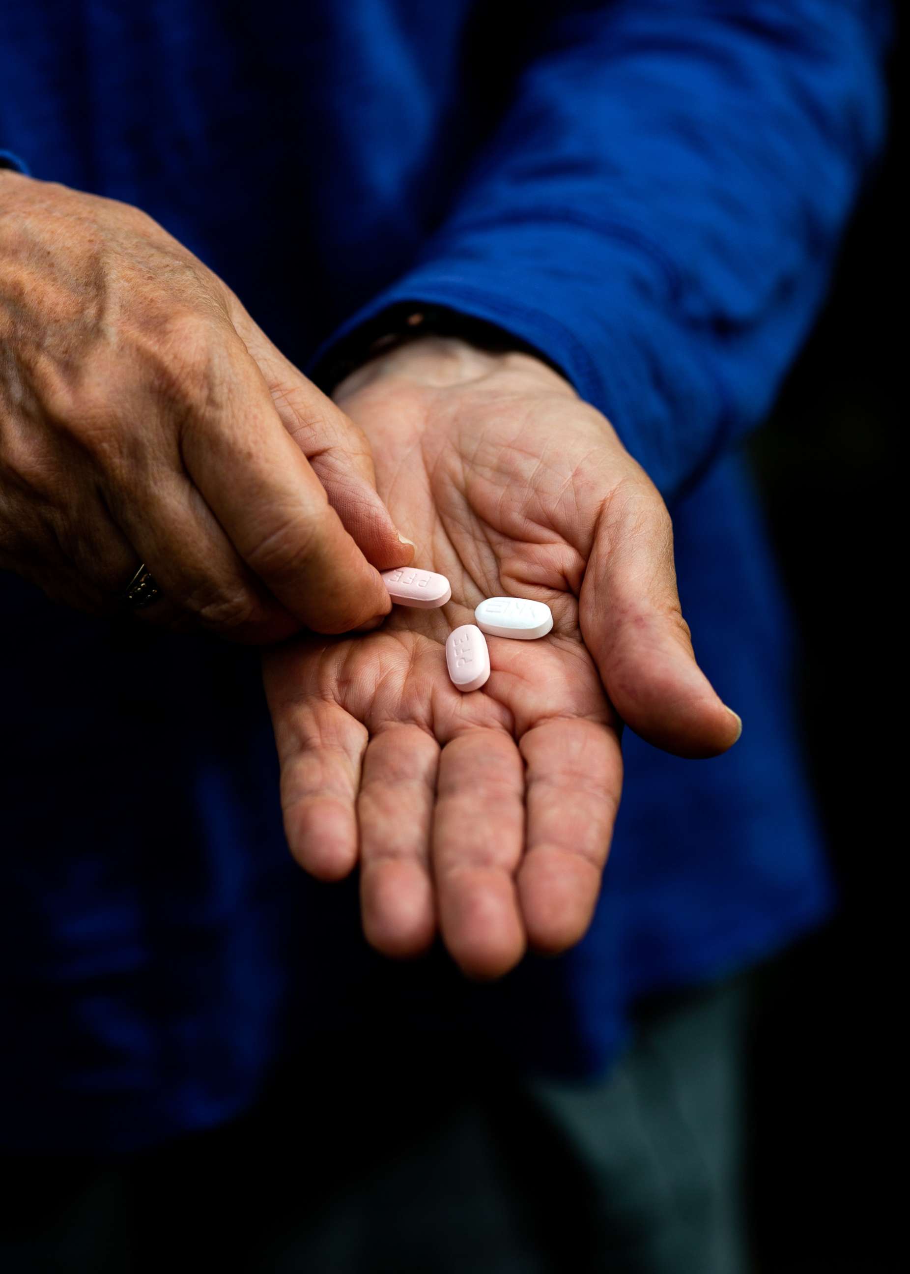 PHOTO: In this Jan. 6, 2022, file photo, a woman holds her last Paxlovid pills while recovering from COVID-19 in Santa Barbara, Calif.