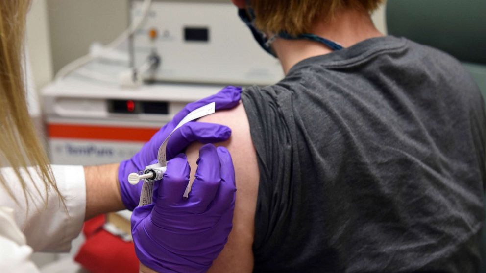 PHOTO: The first patient enrolled in Pfizer's COVID-19 coronavirus vaccine clinical trial at the University of Maryland School of Medicine in Baltimore, receives an injection, May 4, 2020. 