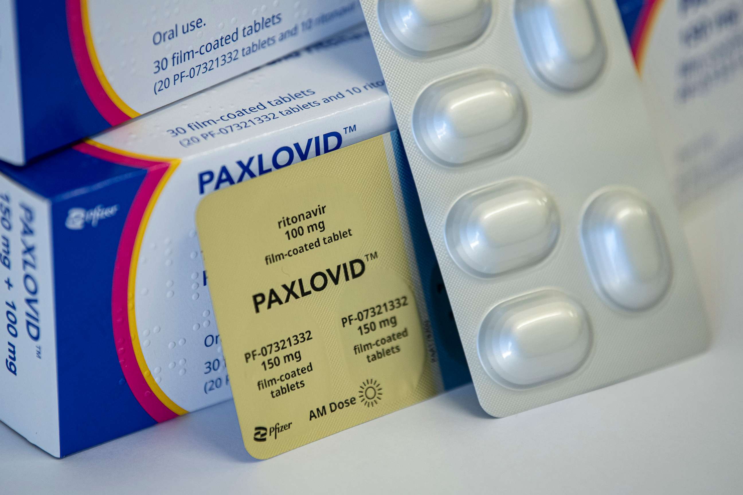 PHOTO: The drug Paxlovid against Covid-19 from the manufacturer Pfizer is stacked on a table in Berlin, March 1, 2022.	 