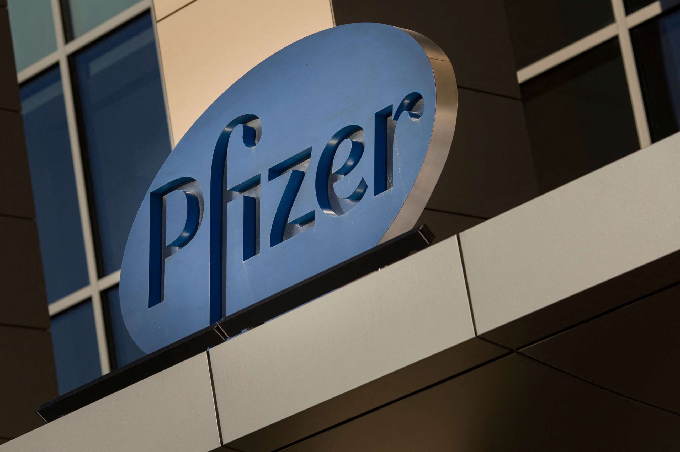 PHOTO: In this file photo a sign for Pfizer pharmaceutical company is seen on a building in Cambridge, Massachusetts. 