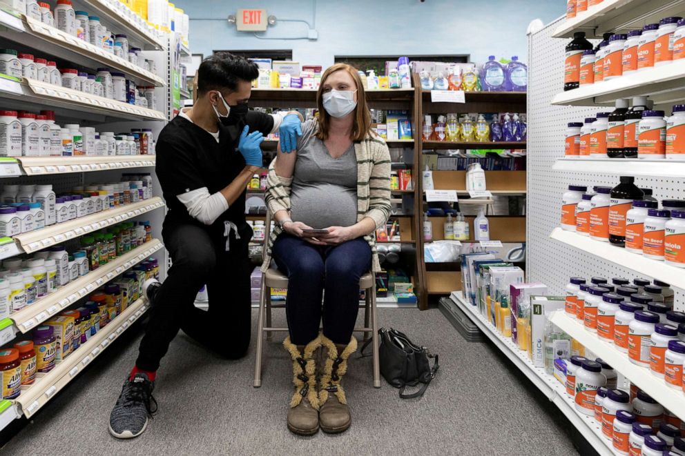 PHOTO: In this Feb. 11, 2021, file photo, Michelle Melton, who is 35 weeks pregnant, receives the Pfizer-BioNTech vaccine against the coronavirus disease at Skippack Pharmacy in Schwenksville, Pa.