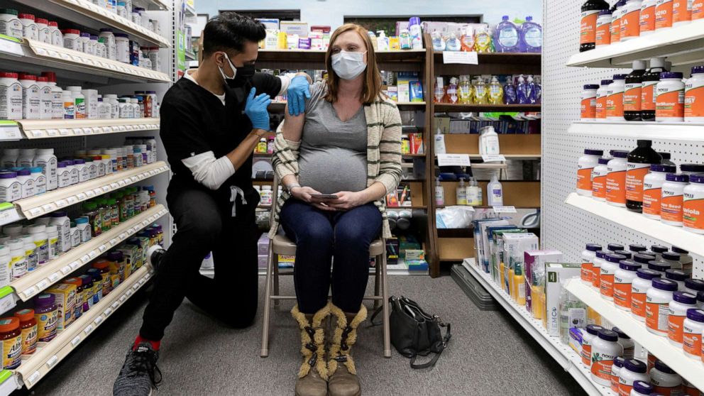 PHOTO: In this Feb. 11, 2021, file photo, Michelle Melton, who is 35 weeks pregnant, receives the Pfizer-BioNTech vaccine against the coronavirus disease at Skippack Pharmacy in Schwenksville, Pa.